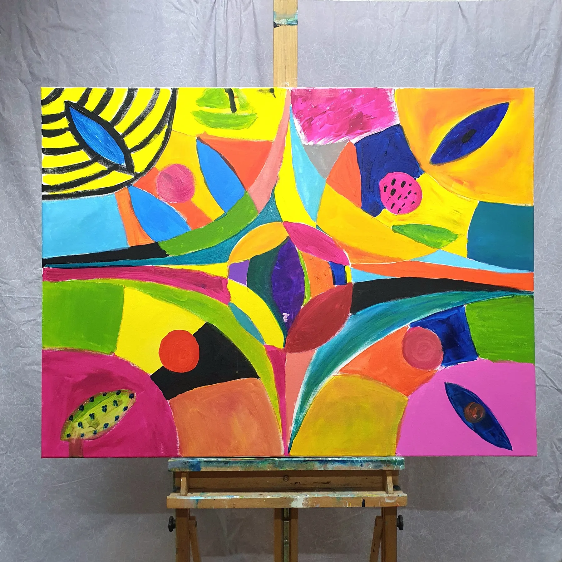 Colourful abstract painting with geometric shapes and leaf-like patterns