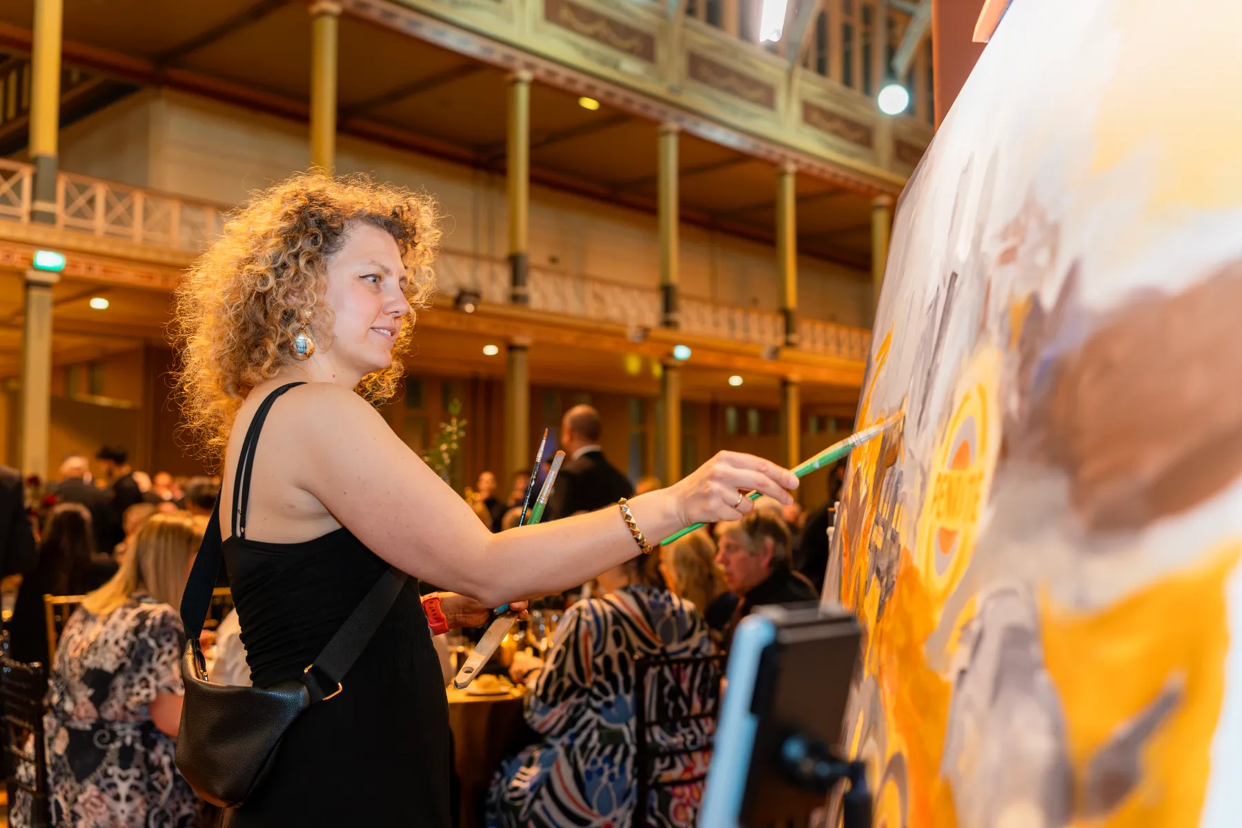 Olga painting live at the Penrite centenary event