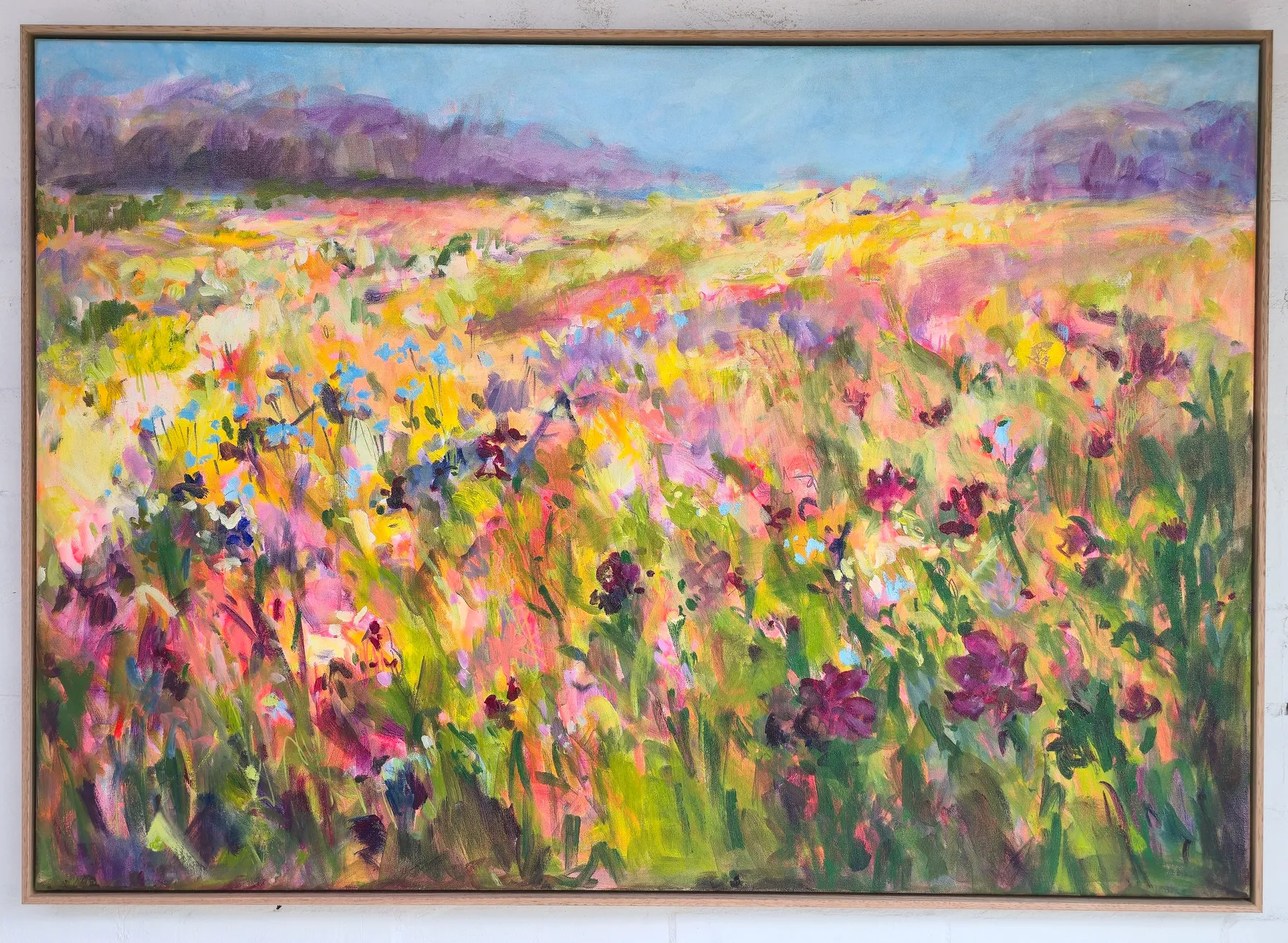 Spring Soirée painting with bright yellow, pink and purple flowers in an expressive landscape